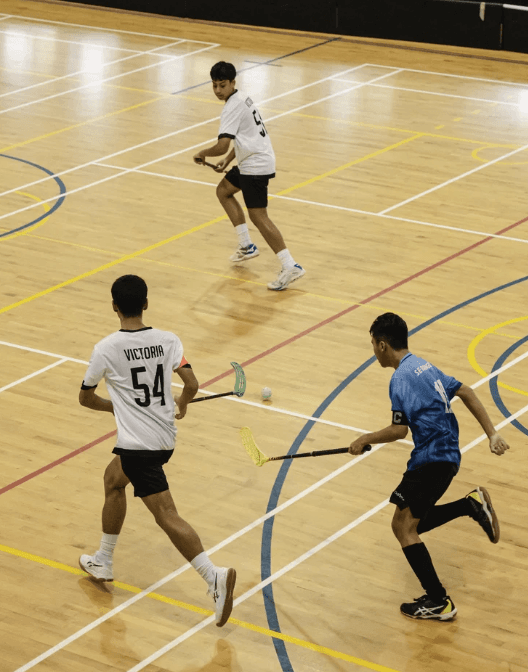School floorball match in an indoor sports hall